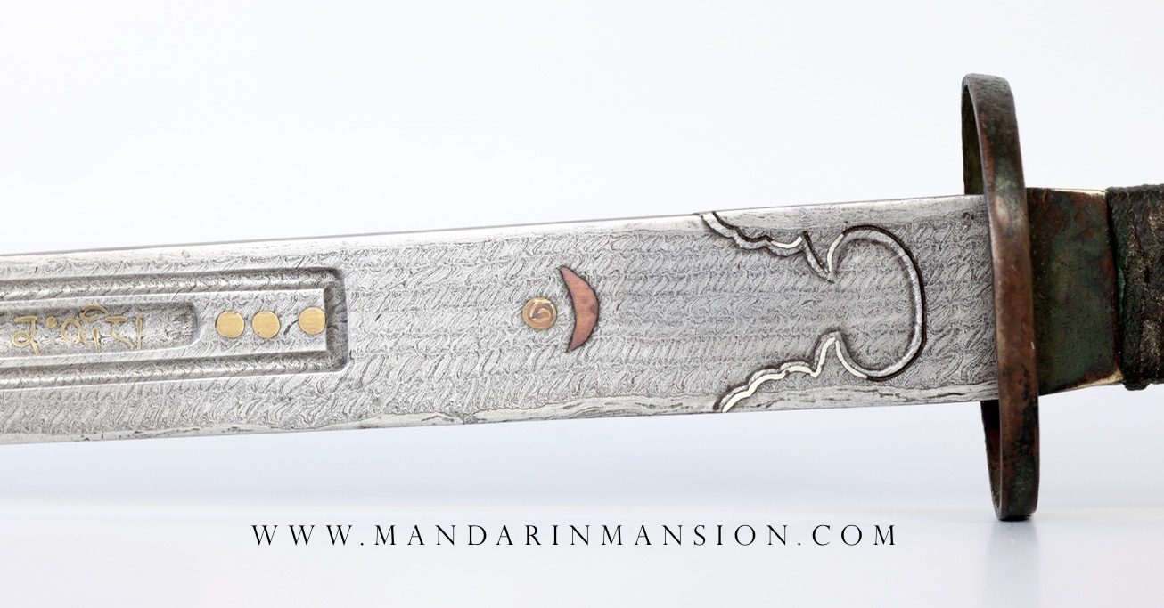 A Chinese twistcore presentation saber with Tibetan markings. www.mandarinmansion.com