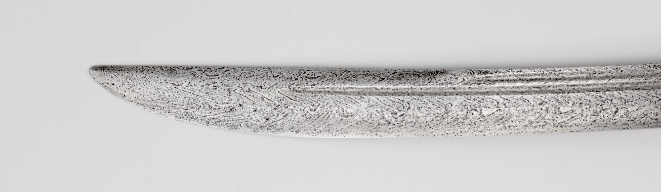 An antique Chinese saber with twist-core blade and U-turn grooves. www.mandarinmansion.com