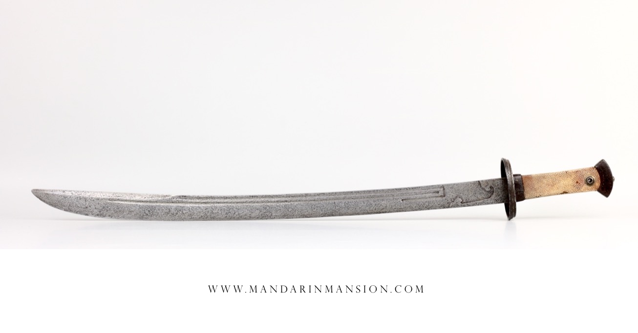 An antique Chinese saber with twist-core blade and U-turn grooves. www.mandarinmansion.com