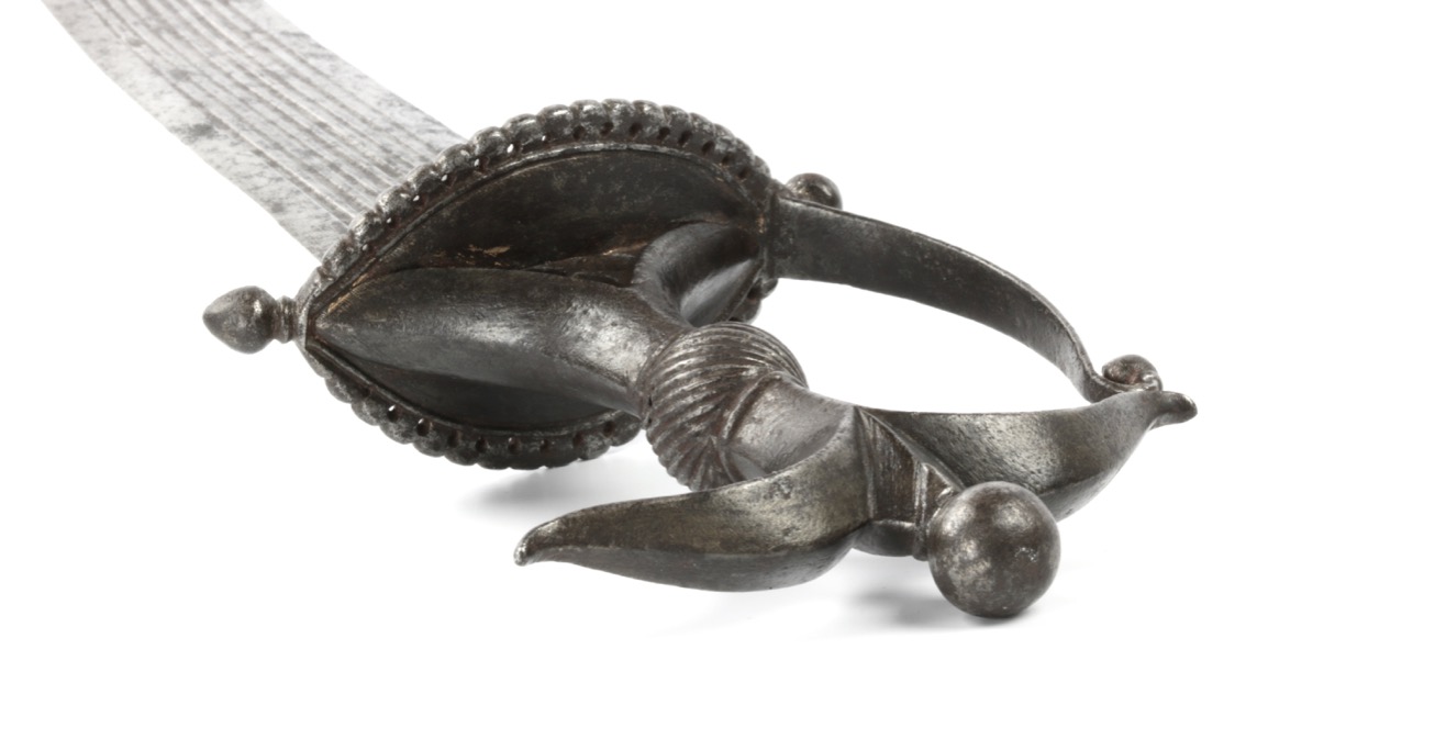 A fine Deccan Chilanum dagger with characteristic all steel hilt. Of robust form with with fine flower bud finials.